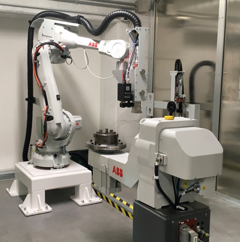 La cella di tempratura laser di Nextema con robot ABB.