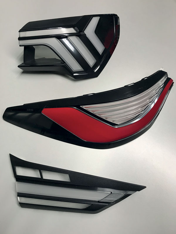 Lenti interne posteriori stampate in tri-materiale per il settore automotive.